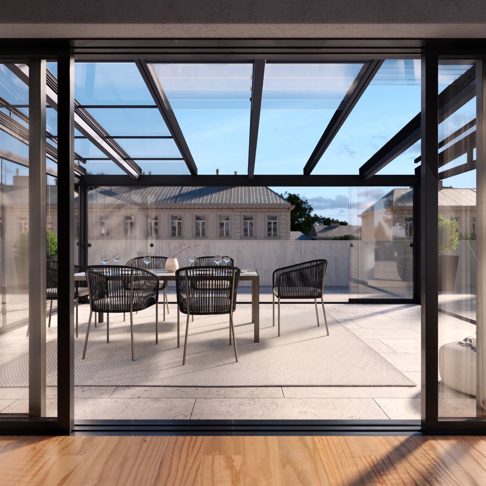 Blick aus dem Wohnraum auf eine Dachterrasse mit Glas-Schiebe-Dach ROOFS und Esstisch